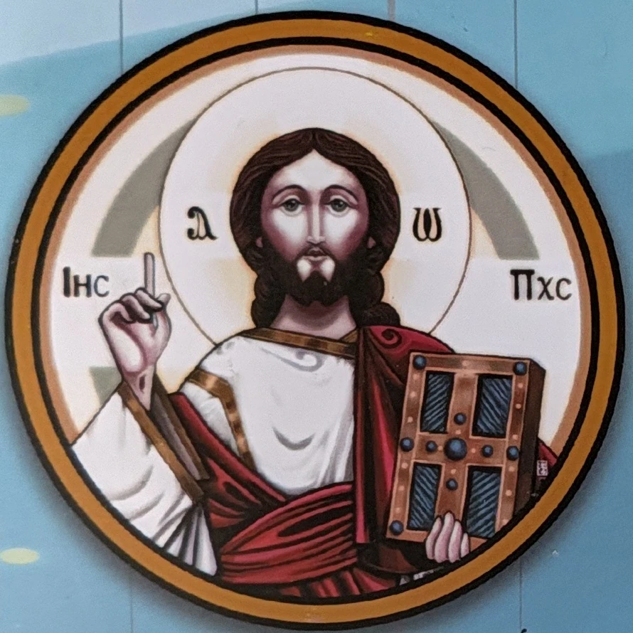 Christ holding the Gospel book